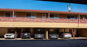 A parking garage with cars parked in it.